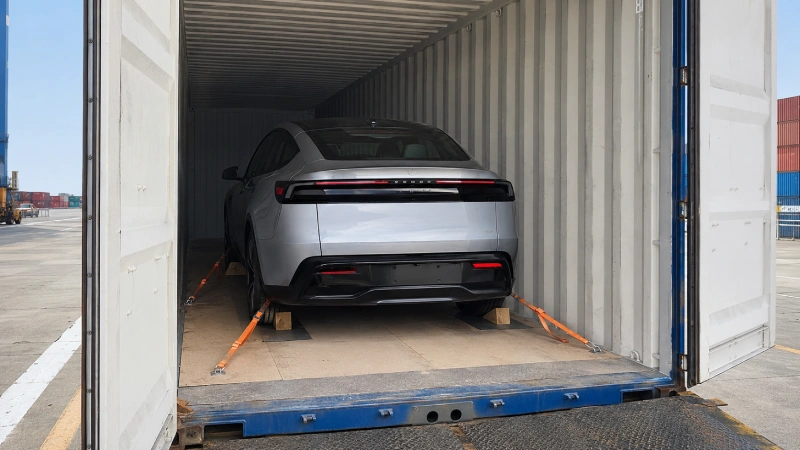 Electric car secured inside a shipping container
